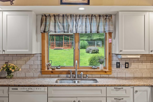 40 Devonshire Dr, Waterford, CT 06385 - kitchen featuring dishwasher, white cabinetry, backsplash, and light stone countertops