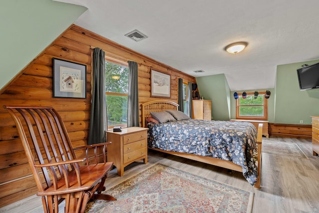40 Devonshire Dr, Waterford, CT 06385 - bedroom featuring log walls and wood finished floors
