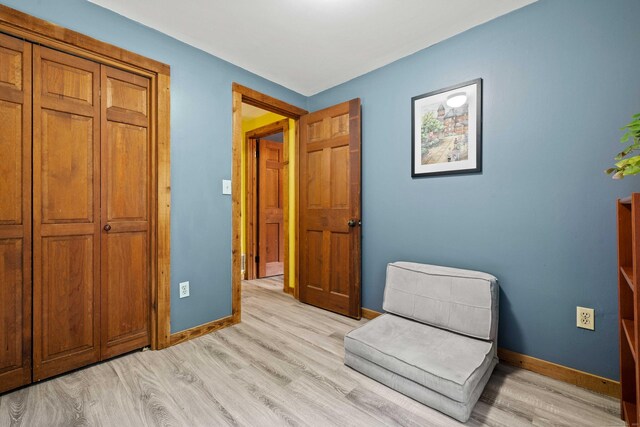 40 Devonshire Dr, Waterford, CT 06385 - sitting room with light wood-style flooring and baseboards