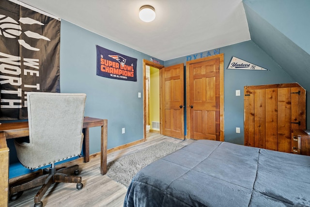 40 Devonshire Dr, Waterford, CT 06385 - bedroom featuring wood finished floors and vaulted ceiling