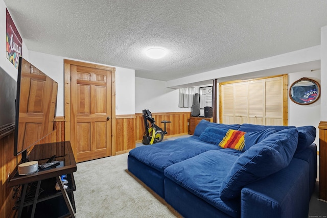 40 Devonshire Dr, Waterford, CT 06385 - living area with wood walls, a wainscoted wall, a textured ceiling, and carpet floors