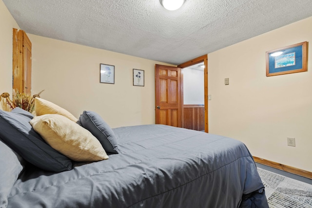 40 Devonshire Dr, Waterford, CT 06385 - bedroom featuring a textured ceiling and baseboards