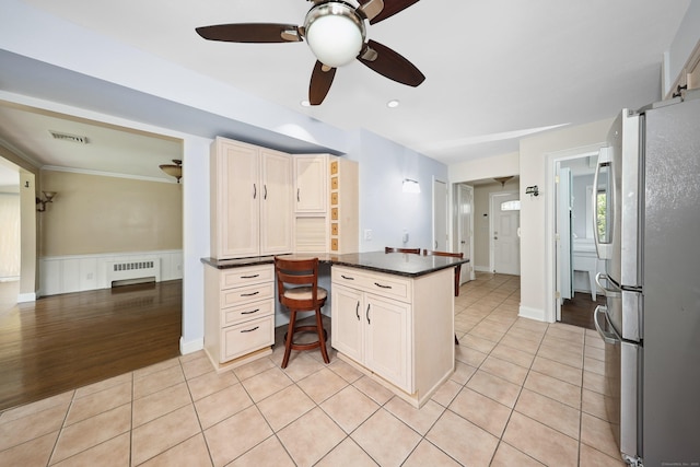 5338 Main St, Trumbull, CT 06611 - kitchen with freestanding refrigerator, a peninsula, radiator, built in study area, and ceiling fan