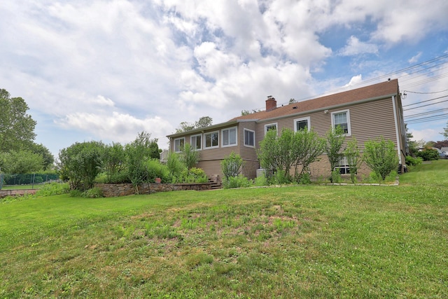 5338 Main St, Trumbull, CT 06611 - back of house with a chimney and a yard
