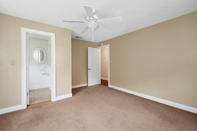 5338 Main St, Trumbull, CT 06611 - unfurnished bedroom featuring light carpet, a ceiling fan, and connected bathroom