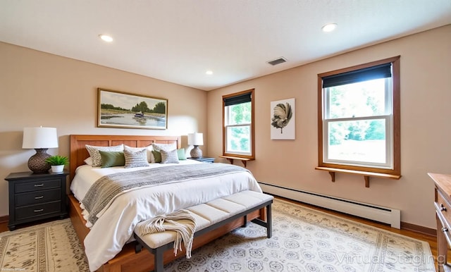 53 Princeton Dr, Middletown, CT 06457 - bedroom with baseboard heating, light wood-type flooring, and recessed lighting