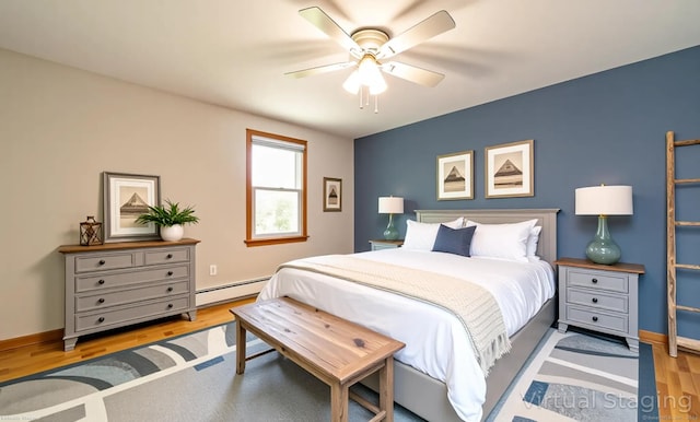 53 Princeton Dr, Middletown, CT 06457 - bedroom featuring a baseboard radiator, wood finished floors, and ceiling fan