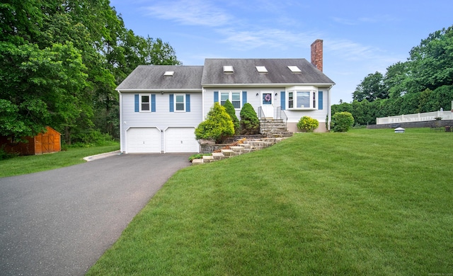 53 Princeton Dr, Middletown, CT 06457 - view of front of house featuring a chimney, driveway, and an attached garage