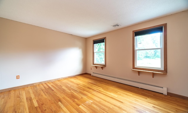 53 Princeton Dr, Middletown, CT 06457 - empty room featuring a baseboard radiator and wood finished floors