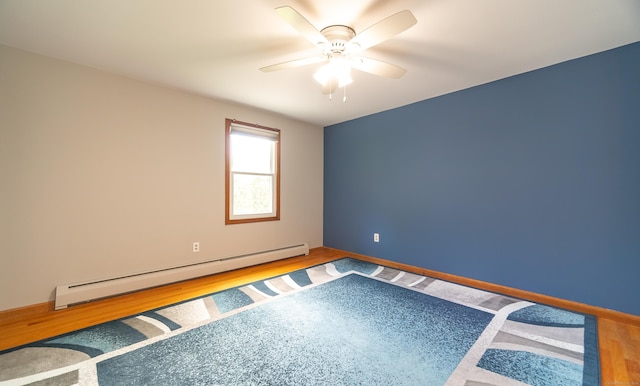 53 Princeton Dr, Middletown, CT 06457 - empty room featuring baseboard heating, a ceiling fan, and wood finished floors