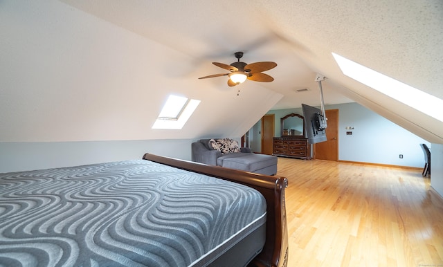 53 Princeton Dr, Middletown, CT 06457 - bedroom with a skylight, light wood-style floors, and vaulted ceiling