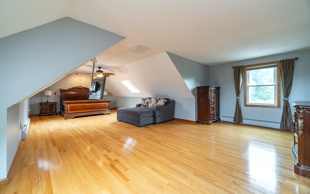 53 Princeton Dr, Middletown, CT 06457 - bedroom featuring wood finished floors, lofted ceiling, and a baseboard heating unit
