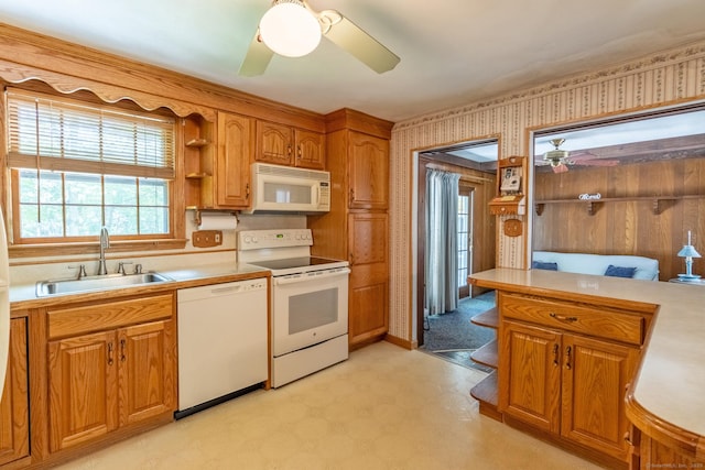 841 S Curtis St, Meriden, CT 06450 - kitchen featuring white appliances, ceiling fan, light flooring, light countertops, and brown cabinets