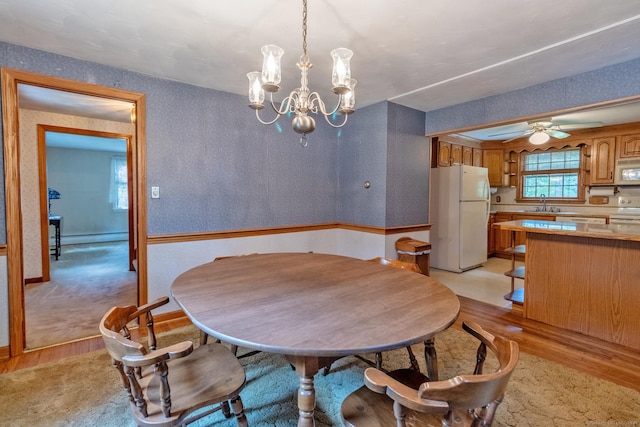 841 S Curtis St, Meriden, CT 06450 - dining area featuring light wood-style floors, a chandelier, a baseboard radiator, and ceiling fan