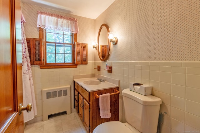 841 S Curtis St, Meriden, CT 06450 - bathroom with radiator, wallpapered walls, vanity, tile walls, and tile patterned flooring