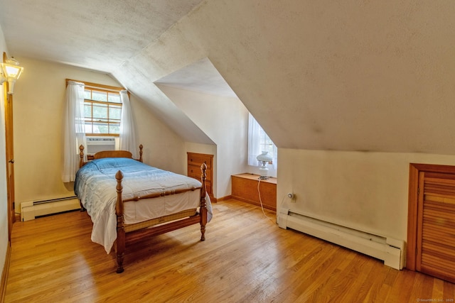 841 S Curtis St, Meriden, CT 06450 - bedroom featuring a baseboard heating unit, a baseboard radiator, vaulted ceiling, light wood-type flooring, and cooling unit