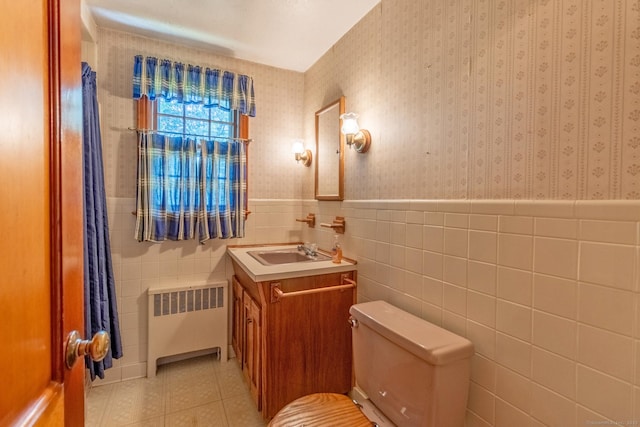 841 S Curtis St, Meriden, CT 06450 - half bathroom featuring radiator, vanity, wallpapered walls, wainscoting, and tile patterned floors