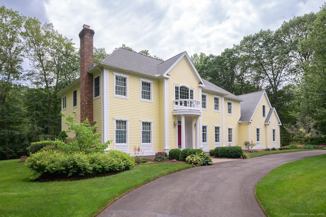 20 Portage Xing, Farmington, CT 06032 - view of front of home featuring a chimney, a front yard, and a balcony