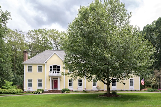20 Portage Xing, Farmington, CT 06032 - view of front facade with a front yard and a chimney