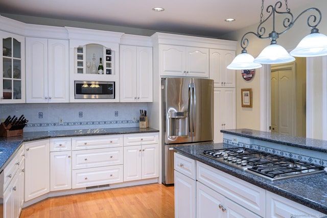20 Portage Xing, Farmington, CT 06032 - kitchen with appliances with stainless steel finishes, glass insert cabinets, white cabinets, hanging light fixtures, and recessed lighting