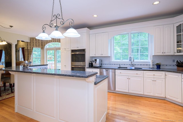 20 Portage Xing, Farmington, CT 06032 - kitchen featuring appliances with stainless steel finishes, a center island, white cabinetry, and recessed lighting