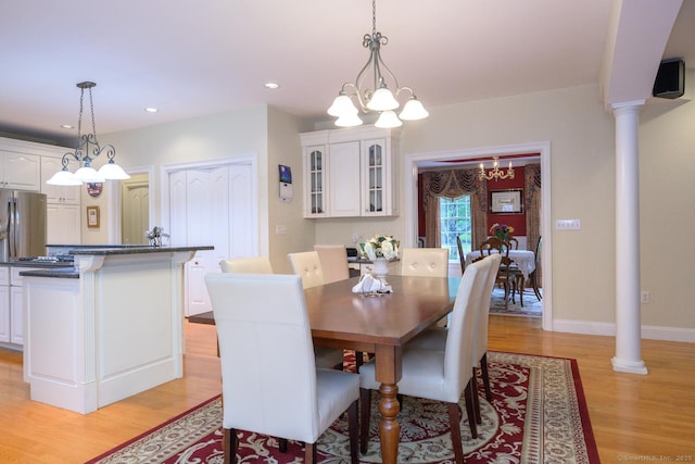 20 Portage Xing, Farmington, CT 06032 - dining area featuring a chandelier, light wood-style flooring, recessed lighting, and ornate columns