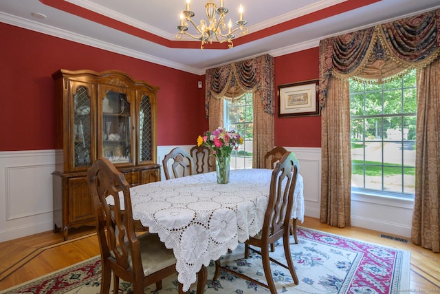 20 Portage Xing, Farmington, CT 06032 - dining area with a chandelier, light wood finished floors, healthy amount of natural light, a wainscoted wall, and crown molding