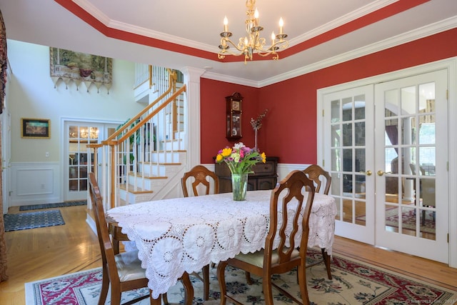 20 Portage Xing, Farmington, CT 06032 - dining room with a chandelier, stairs, a wainscoted wall, french doors, and ornamental molding