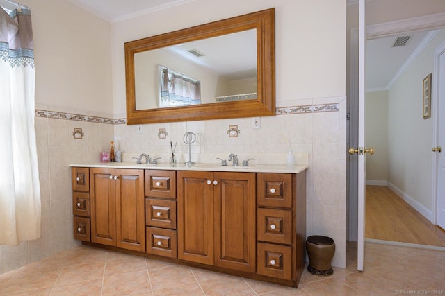 20 Portage Xing, Farmington, CT 06032 - bathroom featuring tile walls, crown molding, double vanity, and tile patterned floors