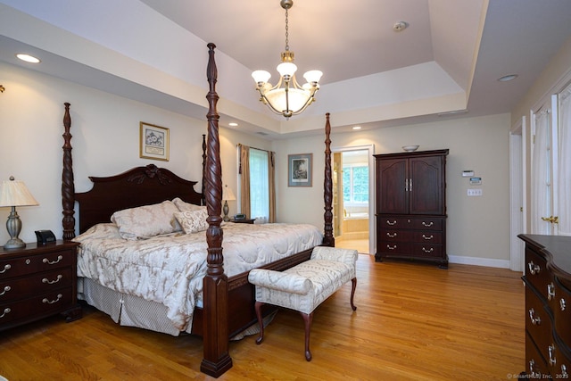20 Portage Xing, Farmington, CT 06032 - bedroom featuring a chandelier, a raised ceiling, light wood-type flooring, recessed lighting, and connected bathroom