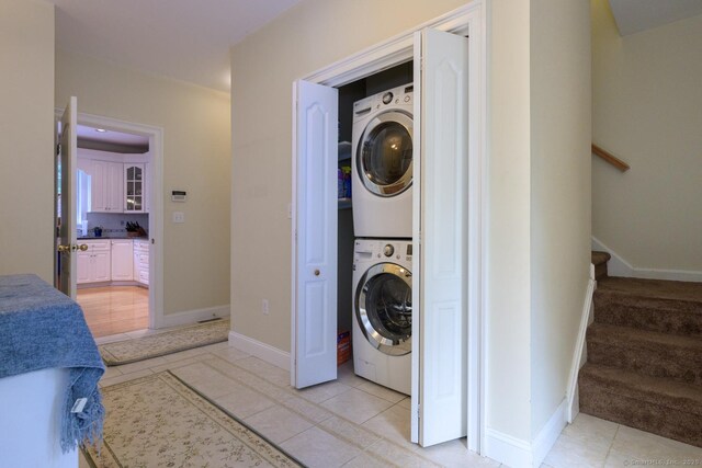20 Portage Xing, Farmington, CT 06032 - laundry room with stacked washer and clothes dryer and baseboards