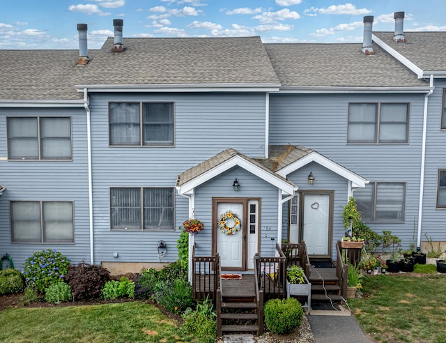 708 Lake Vista Dr Unit 708, East Hampton, CT 06424 - view of property featuring a front lawn and roof with shingles
