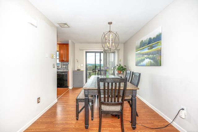 708 Lake Vista Dr Unit 708, East Hampton, CT 06424 - dining area featuring a chandelier and light wood-style flooring