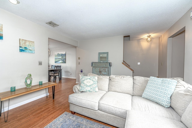 708 Lake Vista Dr Unit 708, East Hampton, CT 06424 - living room with wood finished floors and a textured ceiling