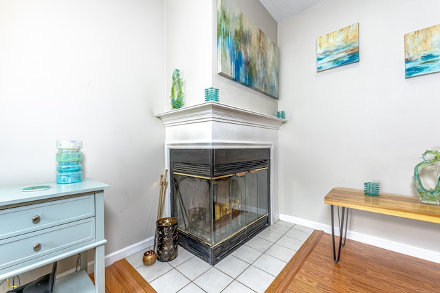 708 Lake Vista Dr Unit 708, East Hampton, CT 06424 - detailed view of a multi sided fireplace and baseboards