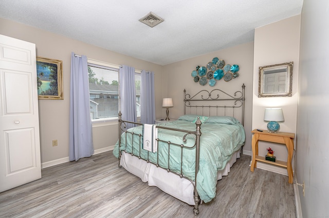 708 Lake Vista Dr Unit 708, East Hampton, CT 06424 - bedroom with light wood-style floors and baseboards