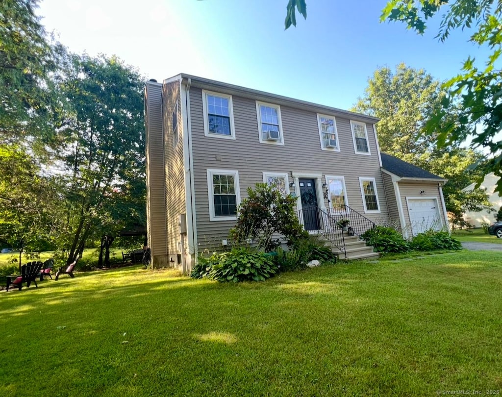 101 Prospect St, Putnam, CT 06260 - colonial house featuring an attached garage, a chimney, and a front yard