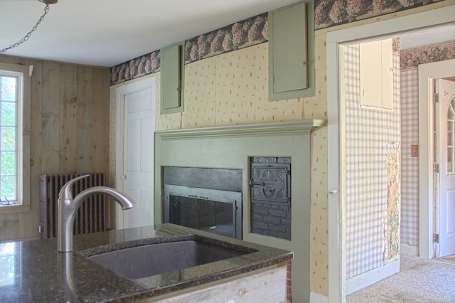 940 Saybrook Rd, Haddam, CT 06438 - kitchen featuring green cabinetry, radiator heating unit, a fireplace, and plenty of natural light