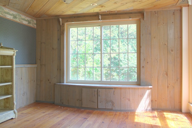 940 Saybrook Rd, Haddam, CT 06438 - spare room featuring hardwood / wood-style floors, healthy amount of natural light, wooden walls, wallpapered walls, and wooden ceiling