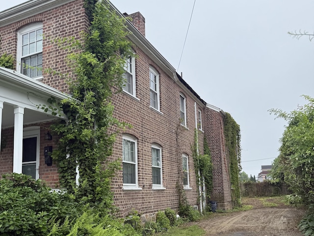 27 Longview Ave, Fairfield, CT 06824 - view of home's exterior with brick siding and a chimney