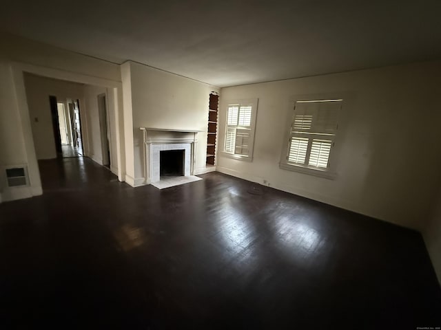 27 Longview Ave, Fairfield, CT 06824 - unfurnished living room with a fireplace and dark wood-type flooring