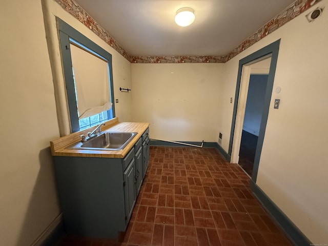 27 Longview Ave, Fairfield, CT 06824 - kitchen with brick patterned floors, light countertops, and gray cabinetry