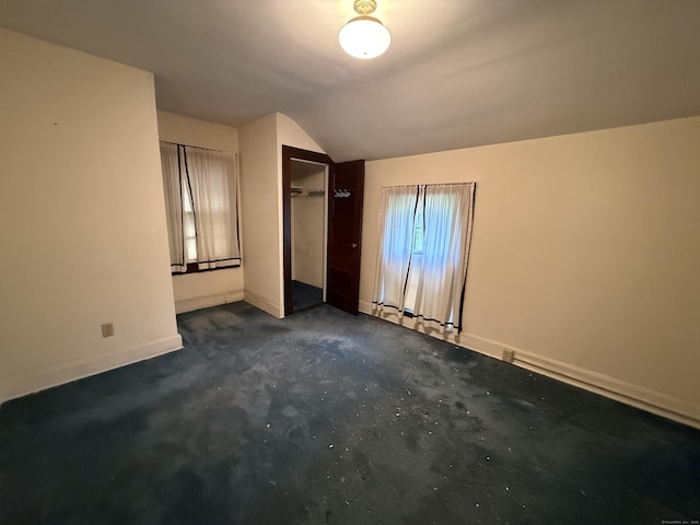 27 Longview Ave, Fairfield, CT 06824 - unfurnished bedroom with lofted ceiling and a closet