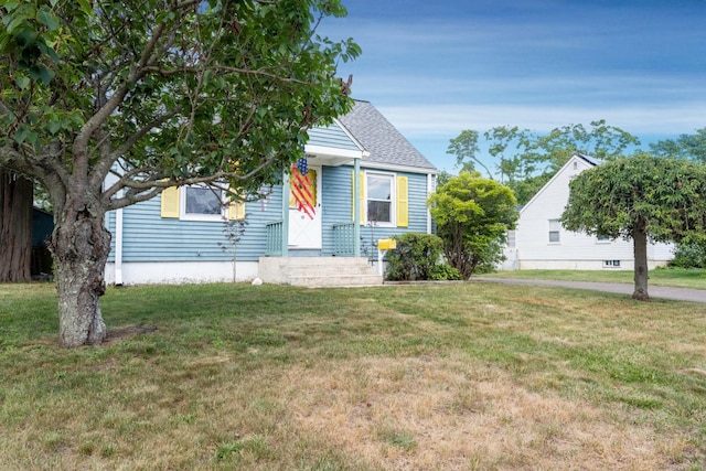 102 Vista Dr, East Haven, CT 06512 - view of front facade with a front lawn and roof with shingles