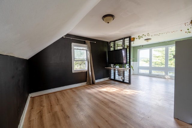 102 Vista Dr, East Haven, CT 06512 - unfurnished living room with wood finished floors and lofted ceiling