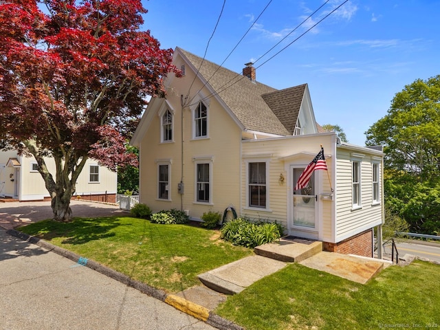 2 Ashby St, Groton, CT 06355 - view of front facade with a shingled roof, a front yard, and a chimney