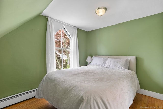 2 Ashby St, Groton, CT 06355 - bedroom with a baseboard heating unit, wood finished floors, and lofted ceiling