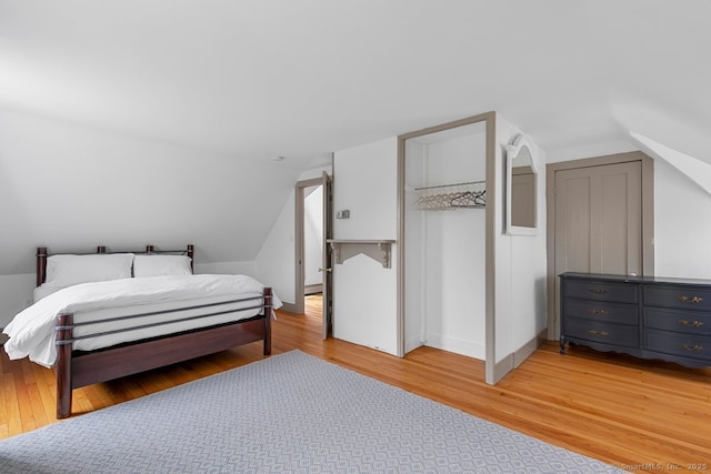 2 Ashby St, Groton, CT 06355 - bedroom with vaulted ceiling and light wood-style flooring
