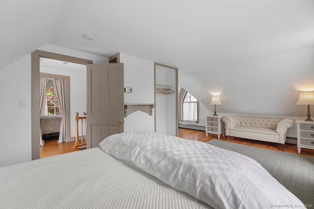 2 Ashby St, Groton, CT 06355 - bedroom featuring vaulted ceiling, wood finished floors, and a baseboard heating unit