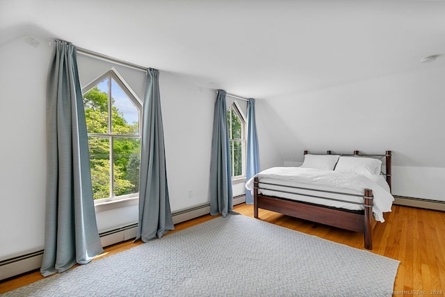 2 Ashby St, Groton, CT 06355 - bedroom with lofted ceiling, multiple windows, wood finished floors, and baseboard heating